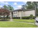 Exterior view of the two-story apartment building featuring well-maintained landscaping at 405 Pipers Ln. # 405, Myrtle Beach, SC 29575