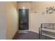 The front door with a bench and decorative flower wall decor at 405 Pipers Ln. # 405, Myrtle Beach, SC 29575