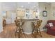 Kitchen bar with light cabinets, decorative accents, and comfortable rattan bar stools at 405 Pipers Ln. # 405, Myrtle Beach, SC 29575