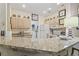 Spacious kitchen featuring granite countertops, light cabinets, and modern appliances at 405 Pipers Ln. # 405, Myrtle Beach, SC 29575