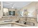 Granite countertops are complemented by a stainless steel sink and modern appliances at 405 Pipers Ln. # 405, Myrtle Beach, SC 29575
