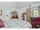 Spacious bedroom with four poster bed and doorways leading to living spaces at 405 Pipers Ln. # 405, Myrtle Beach, SC 29575