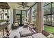 Relaxing patio with wicker furniture, tile flooring, and a view of the landscaped yard at 405 Pipers Ln. # 405, Myrtle Beach, SC 29575