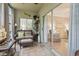 Cozy outdoor patio featuring wicker furniture and sliding door access to the living room at 405 Pipers Ln. # 405, Myrtle Beach, SC 29575