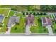 An aerial shot shows the house with white fences, lush greenery and a patio at 405 Vintage Circle, Myrtle Beach, SC 29579