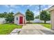 A shed in the backyard has a red door, adding a pop of color at 405 Vintage Circle, Myrtle Beach, SC 29579