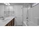 Bathroom with a combination shower and tub, and a wood vanity at 405 Vintage Circle, Myrtle Beach, SC 29579