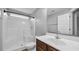 Cozy bathroom with a shower and tub combination and a wood vanity at 405 Vintage Circle, Myrtle Beach, SC 29579