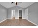 Bedroom with neutral walls, light wood-look flooring, and an open door to a closet at 405 Vintage Circle, Myrtle Beach, SC 29579