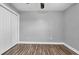 A simply designed bedroom features new flooring and a ceiling fan fixture at 405 Vintage Circle, Myrtle Beach, SC 29579