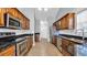 Modern kitchen boasting stainless steel appliances, granite countertops, and ample cabinet space at 405 Vintage Circle, Myrtle Beach, SC 29579