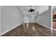 Spacious living room featuring hardwood floors, vaulted ceilings, and a ceiling fan at 405 Vintage Circle, Myrtle Beach, SC 29579