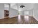 Spacious living room featuring hardwood floors, vaulted ceilings, and a ceiling fan at 405 Vintage Circle, Myrtle Beach, SC 29579