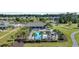 Aerial view of the community pool area showcasing a large pool, a clubhouse, and lush landscaping creating a resort-like atmosphere at 4115 Bayhill St., Myrtle Beach, SC 29579