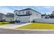 A bright, modern two-story home with a well-maintained lawn, a two car garage, and a charming fence at 4115 Bayhill St., Myrtle Beach, SC 29579