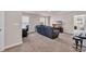 Upstairs living room with black leather reclining couch, television, desk with chair, and keyboard at 4115 Bayhill St., Myrtle Beach, SC 29579