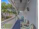 Inviting balcony with seating, a view of a tree-lined street, and a peaceful ambiance at 4309 Beverly Ct., North Myrtle Beach, SC 29582