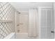 Clean bathroom with a shower, patterned wallpaper, and functional design at 4309 Beverly Ct., North Myrtle Beach, SC 29582