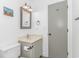 Bathroom featuring a neutral vanity with mirror, toilet, and modern fixtures at 4309 Beverly Ct., North Myrtle Beach, SC 29582