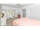 Bright bedroom with a ceiling fan, closet, and access to a private balcony at 4309 Beverly Ct., North Myrtle Beach, SC 29582