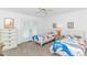 Bright bedroom with twin beds, balcony access, and beach-themed decor at 4309 Beverly Ct., North Myrtle Beach, SC 29582
