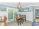 Charming dining area with a wooden table, bright natural light, and stylish decor at 4309 Beverly Ct., North Myrtle Beach, SC 29582