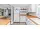 Efficient kitchen featuring white cabinets, wood countertops, and modern appliances at 4309 Beverly Ct., North Myrtle Beach, SC 29582