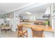 Bright kitchen with wood countertops, white cabinetry, and breakfast bar seating at 4309 Beverly Ct., North Myrtle Beach, SC 29582