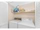 Practical laundry room with modern washer and dryer, efficient storage solutions at 4309 Beverly Ct., North Myrtle Beach, SC 29582