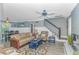 Cozy living room featuring a ceiling fan, comfortable seating, and staircase at 4309 Beverly Ct., North Myrtle Beach, SC 29582