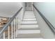 Clean staircase with modern railings connecting the living space of the home at 4309 Beverly Ct., North Myrtle Beach, SC 29582