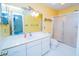Bright bathroom features a spacious white vanity, a toilet, and a stand-alone shower with sliding glass doors at 434 Deer Path, Calabash, NC 28467