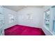 Bedroom with bright red carpet and ample natural light at 434 Deer Path, Calabash, NC 28467