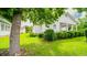 Charming single-story home with lush green lawn, mature trees, and well-maintained landscaping at 434 Deer Path, Calabash, NC 28467