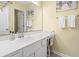 Bright bathroom featuring a large mirror, white cabinets, and beach themed decor at 45 Pinehurst Ln. # 2C, Pawleys Island, SC 29585