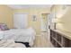 Bright bedroom with bed, storage console, and closet doors at 45 Pinehurst Ln. # 2C, Pawleys Island, SC 29585