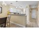 Bright kitchen featuring white cabinets, modern lighting, and an open design concept at 45 Pinehurst Ln. # 2C, Pawleys Island, SC 29585