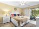 Inviting main bedroom featuring cozy decor, bright walls and a sliding door to the outside at 45 Pinehurst Ln. # 2C, Pawleys Island, SC 29585