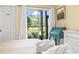 Inviting main bedroom with access to an outdoor patio overlooking the water at 45 Pinehurst Ln. # 2C, Pawleys Island, SC 29585