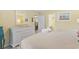 Comfortable main bedroom featuring bright walls, a dresser and access to other rooms at 45 Pinehurst Ln. # 2C, Pawleys Island, SC 29585