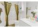 Bathroom with shower and tub combo featuring modern gold fixtures and finishes at 4687 Wild Iris Dr. # 303, Myrtle Beach, SC 29577