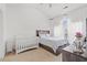Bright bedroom showcasing a bed and a crib with vaulted ceilings and natural light at 4687 Wild Iris Dr. # 303, Myrtle Beach, SC 29577