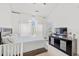 Bright bedroom featuring a bed, and a dresser with vaulted ceilings and natural light at 4687 Wild Iris Dr. # 303, Myrtle Beach, SC 29577