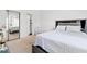 Bright bedroom featuring a bed, a crib, a closet and an ensuite bath at 4687 Wild Iris Dr. # 303, Myrtle Beach, SC 29577