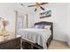 Inviting bedroom with dark wood furniture and ceiling fan at 4687 Wild Iris Dr. # 303, Myrtle Beach, SC 29577