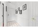 Bright hallway with elegant decor and white tile flooring at 4687 Wild Iris Dr. # 303, Myrtle Beach, SC 29577