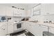 Well-maintained kitchen featuring white cabinets and stainless steel sink at 4687 Wild Iris Dr. # 303, Myrtle Beach, SC 29577