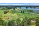 Expansive aerial view of a golf course with multiple lakes, bridges, and rolling greens at 5040 Windsor Green Way # 204, Myrtle Beach, SC 29579