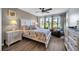 Cozy bedroom featuring a comfortable bed, natural light, and views of the outdoors at 5040 Windsor Green Way # 204, Myrtle Beach, SC 29579