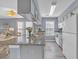 Bright kitchen with granite countertops, white cabinets, and modern stainless steel appliances at 5040 Windsor Green Way # 204, Myrtle Beach, SC 29579